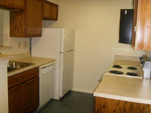 a utility room with sink dryer and washer