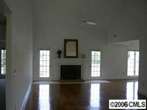 429 Cranborne Chase Fort Mill, SC 29708 - Photo 5 of 8 a view of an empty room with wooden floor and a window