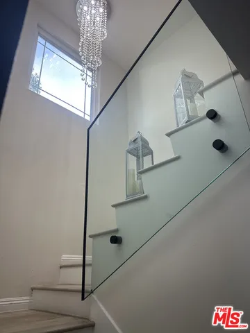 a bathroom with a shower and a mirror