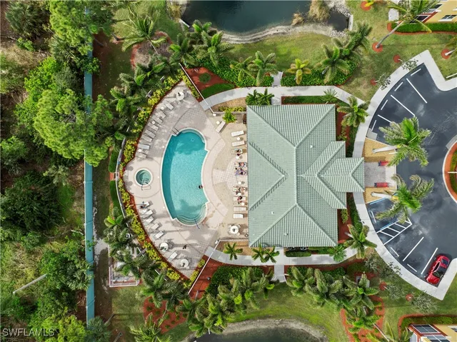 an aerial view of a house with garden space and street view