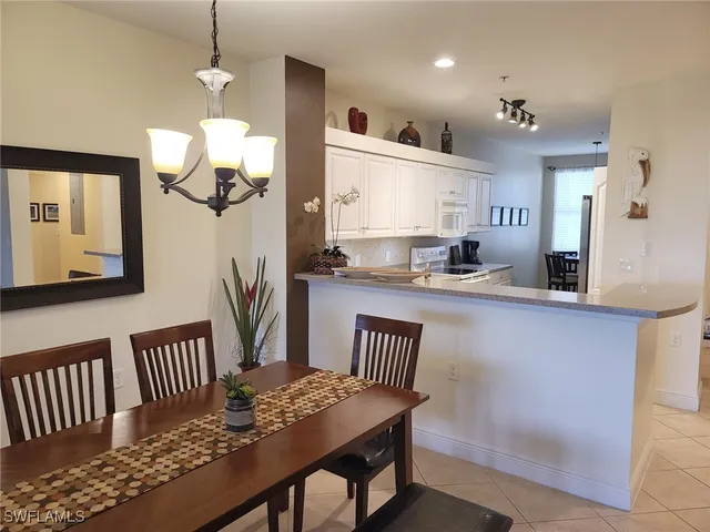 a kitchen with granite countertop lots of counter top space and furniture