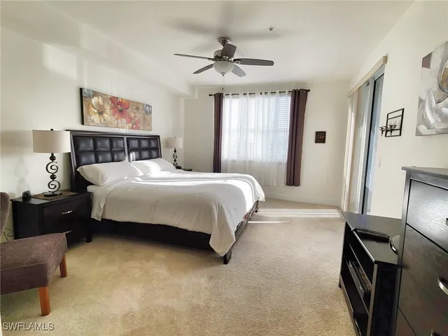 a bedroom with a bed dresser and a window