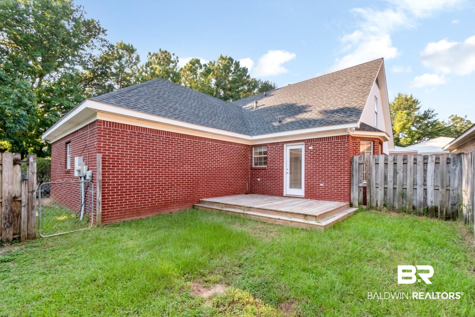 6482 Cedar Bend Court Mobile, AL 36608 - Photo 21 of 26 Rear view of property featuring a deck, a shingled roof, and brick siding
