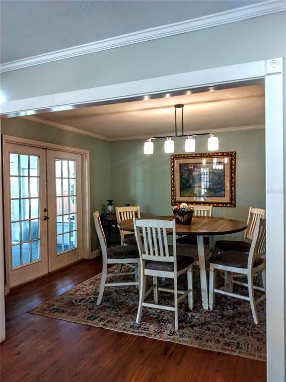 13 Gracie Road DeBary, FL 32713 - Photo 15 of 53 a view of a dining room with furniture window and wooden floor