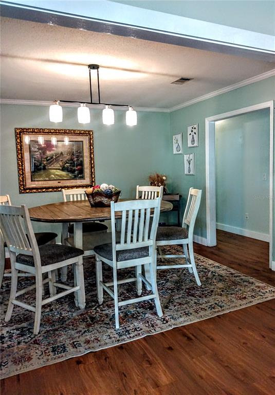 13 Gracie Road DeBary, FL 32713 - Photo 16 of 53 a view of a dining room with furniture wooden floor and window