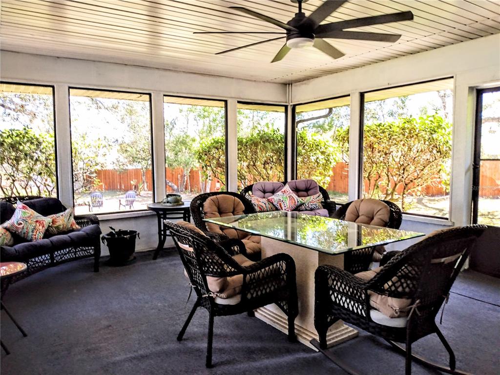 13 Gracie Road DeBary, FL 32713 - Photo 18 of 53 a dining room with furniture a chandelier and wooden floor