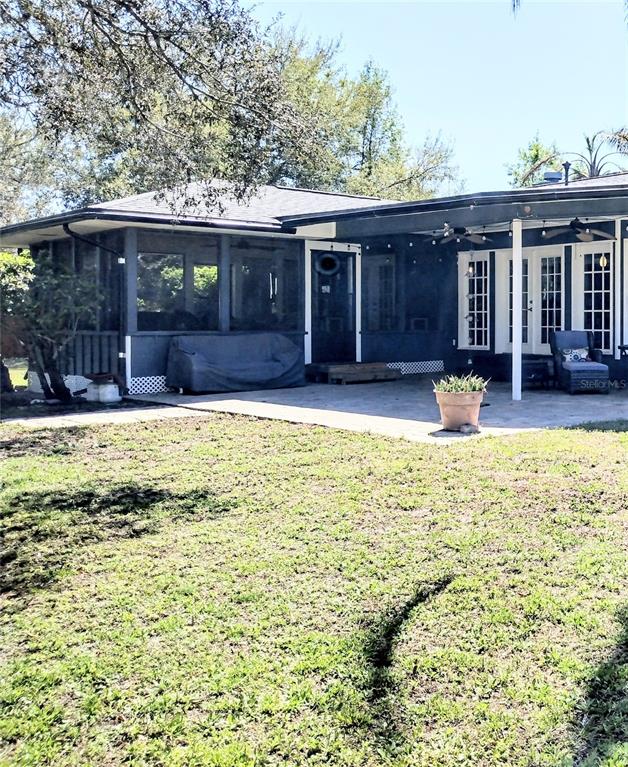 13 Gracie Road DeBary, FL 32713 - Photo 20 of 53 a swimming pool with outdoor seating and yard