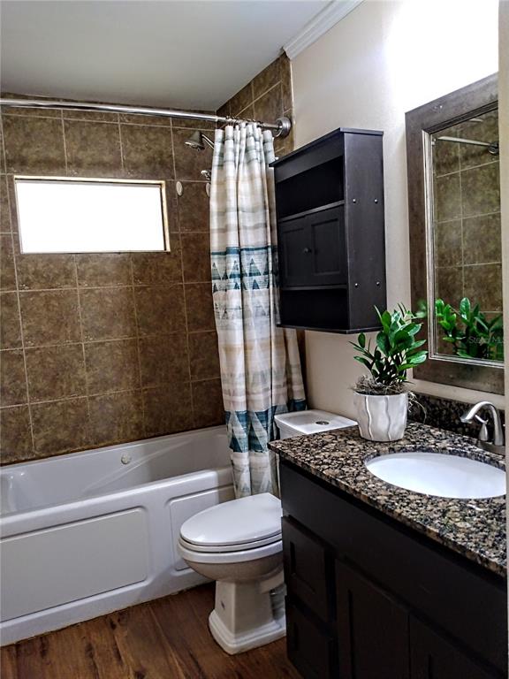 13 Gracie Road DeBary, FL 32713 - Photo 24 of 53 a bathroom with a granite countertop sink mirror vanity bathtub and a toilet