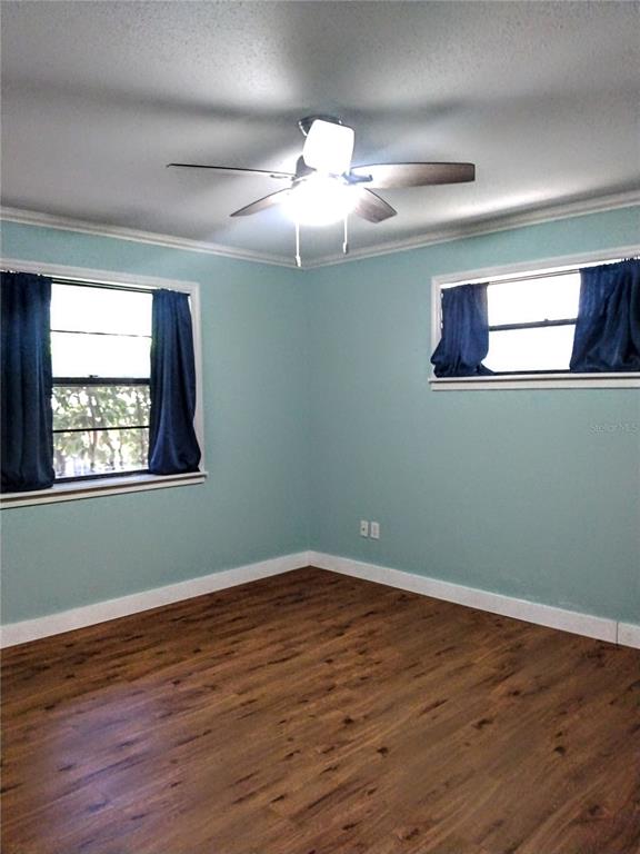 13 Gracie Road DeBary, FL 32713 - Photo 25 of 53 a view of a room with wooden floor and windows