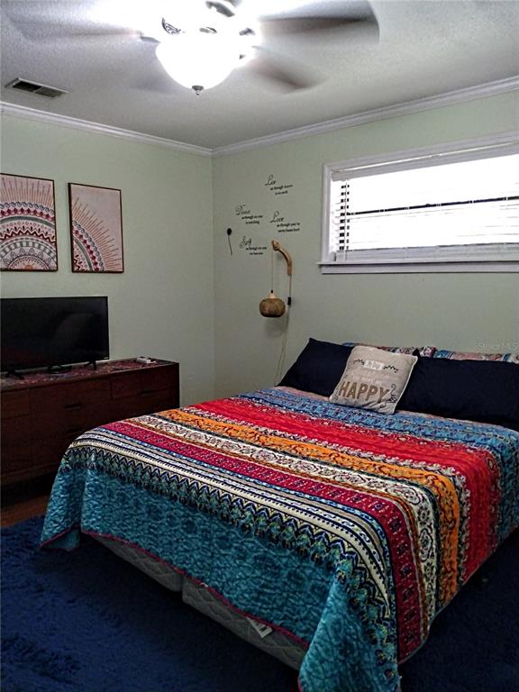 13 Gracie Road DeBary, FL 32713 - Photo 30 of 53 a bedroom with a bed and window