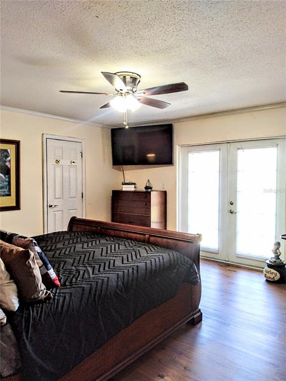 13 Gracie Road DeBary, FL 32713 - Photo 32 of 53 a bedroom with a bed window and a flat screen tv