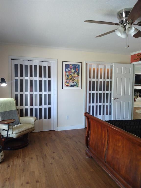 13 Gracie Road DeBary, FL 32713 - Photo 33 of 53 a living room with furniture stairs and a book shelf