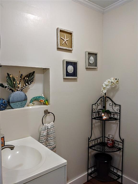 13 Gracie Road DeBary, FL 32713 - Photo 42 of 53 a bathroom with a sink and a mirror