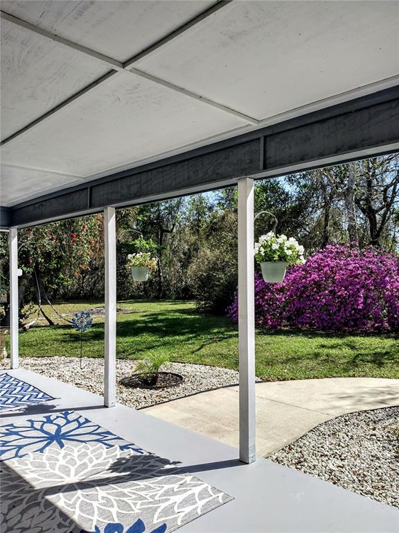 13 Gracie Road DeBary, FL 32713 - Photo 50 of 53 a view of a porch with a yard