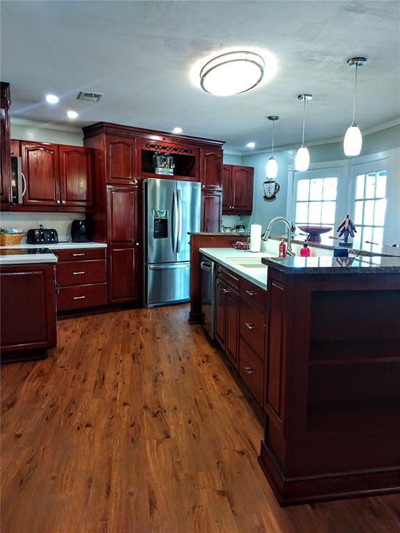 13 Gracie Road DeBary, FL 32713 - Photo 8 of 53 a kitchen with stainless steel appliances kitchen island granite countertop a stove refrigerator and cabinets