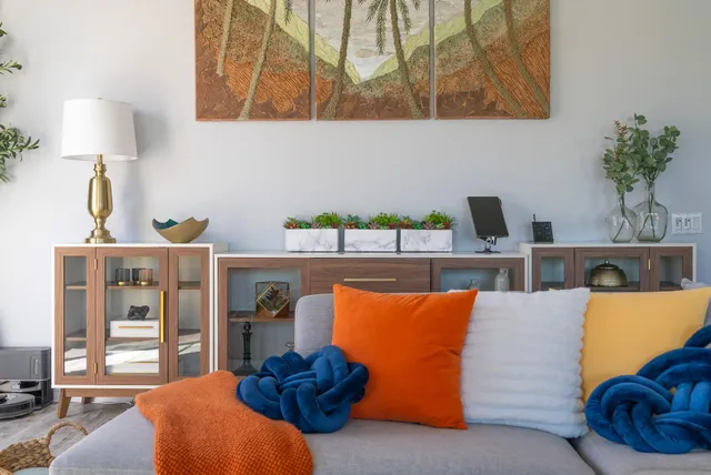 a living room with furniture and a lamp