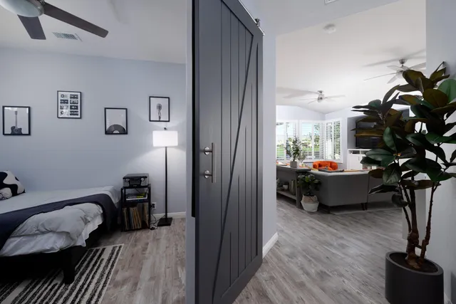 a bedroom with a bed and a window