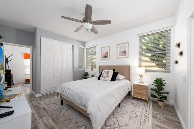 a bedroom with a bed and a window