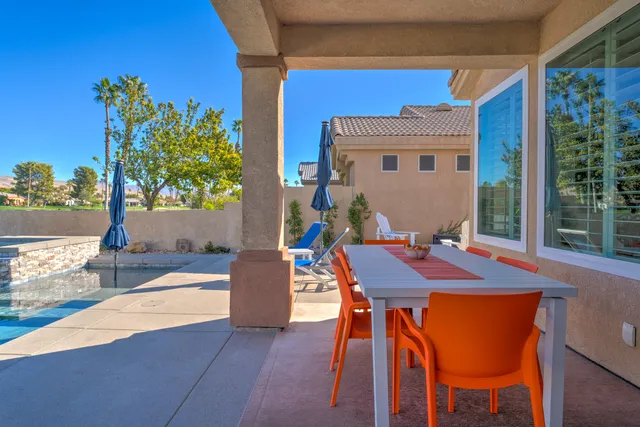 a view of a backyard with a bench