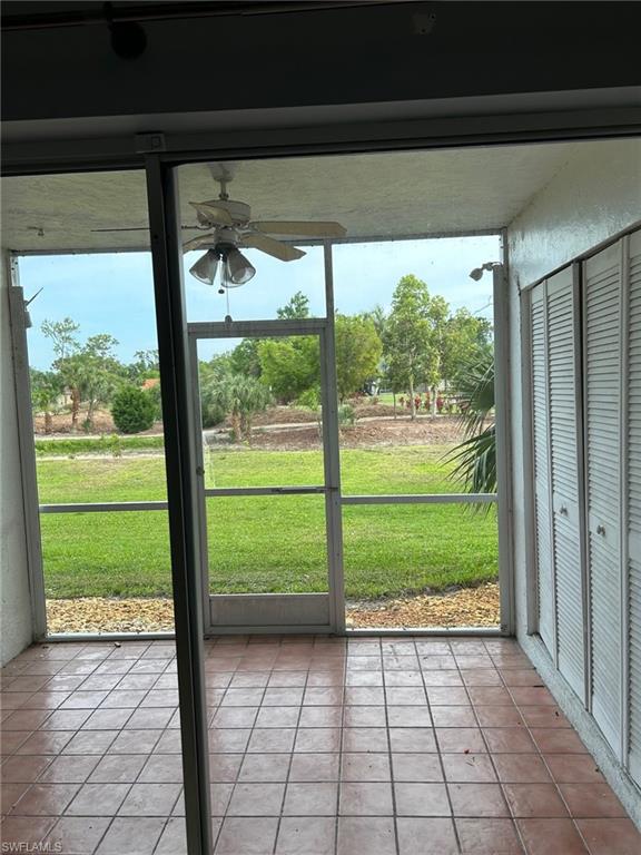 5651 Rattlesnake Hamm Road, Unit C107 Naples, FL 34113 - Photo 14 of 20 SCREENED LANAI AREA OVERLOOKNG THE NEIGHBORING GOLF COURSE