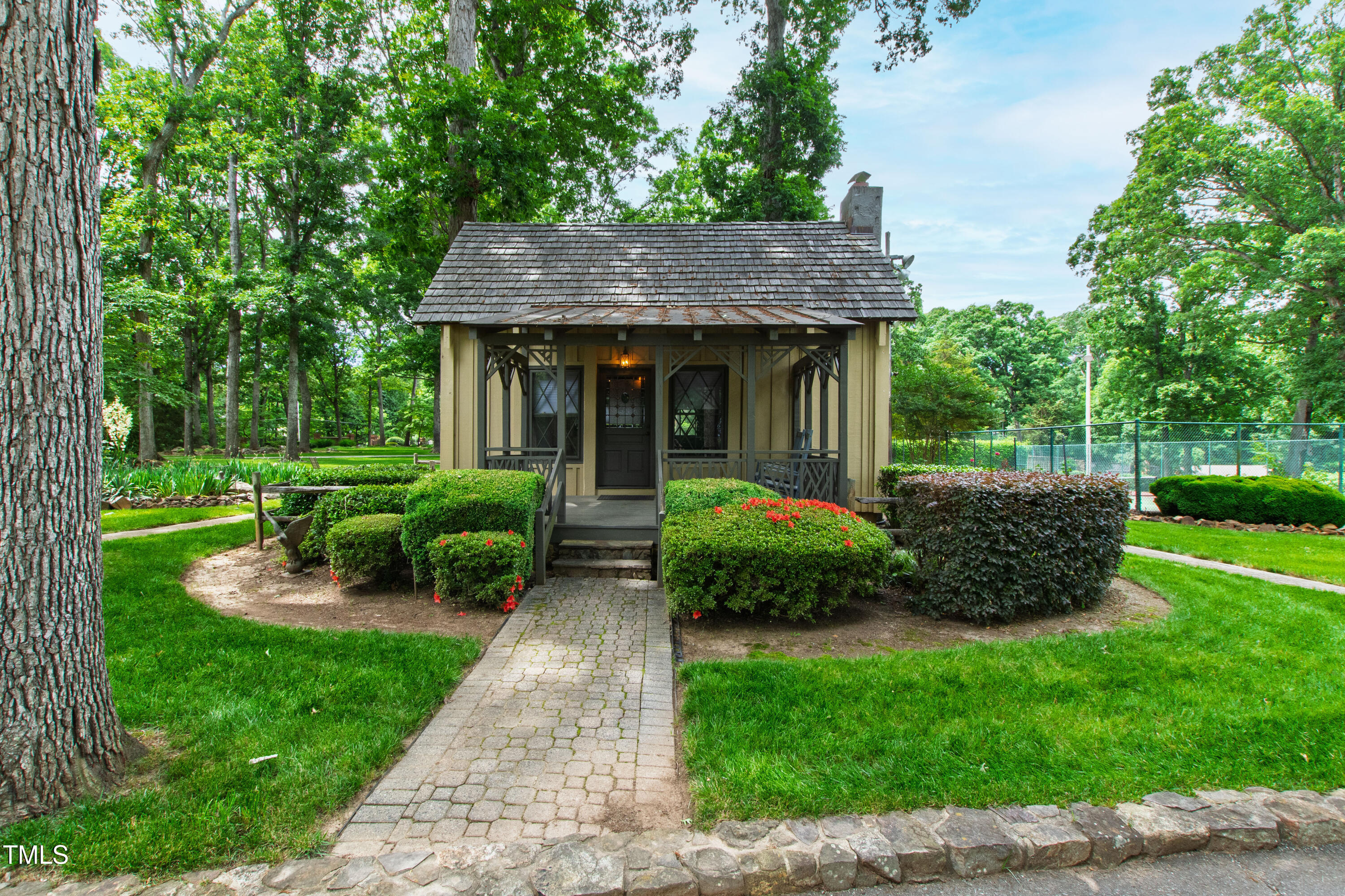 812 Kenmore Road Chapel Hill, NC 27514 - Photo 11 of 95 a front view of a house with a yard table and outdoor seating