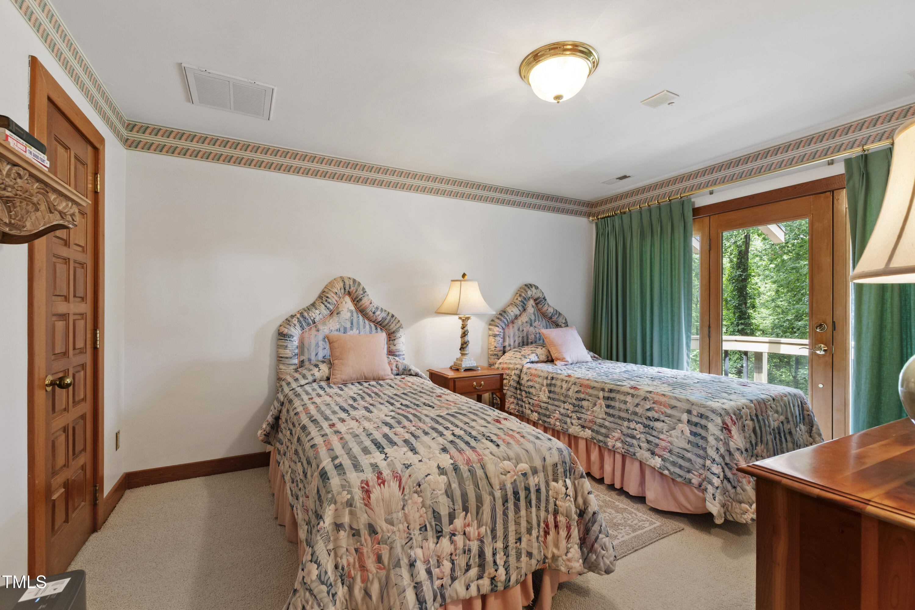 812 Kenmore Road Chapel Hill, NC 27514 - Photo 15 of 95 a bedroom with two beds and a large window