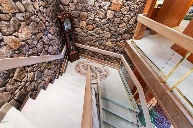 a bathroom with a sink a mirror and a window