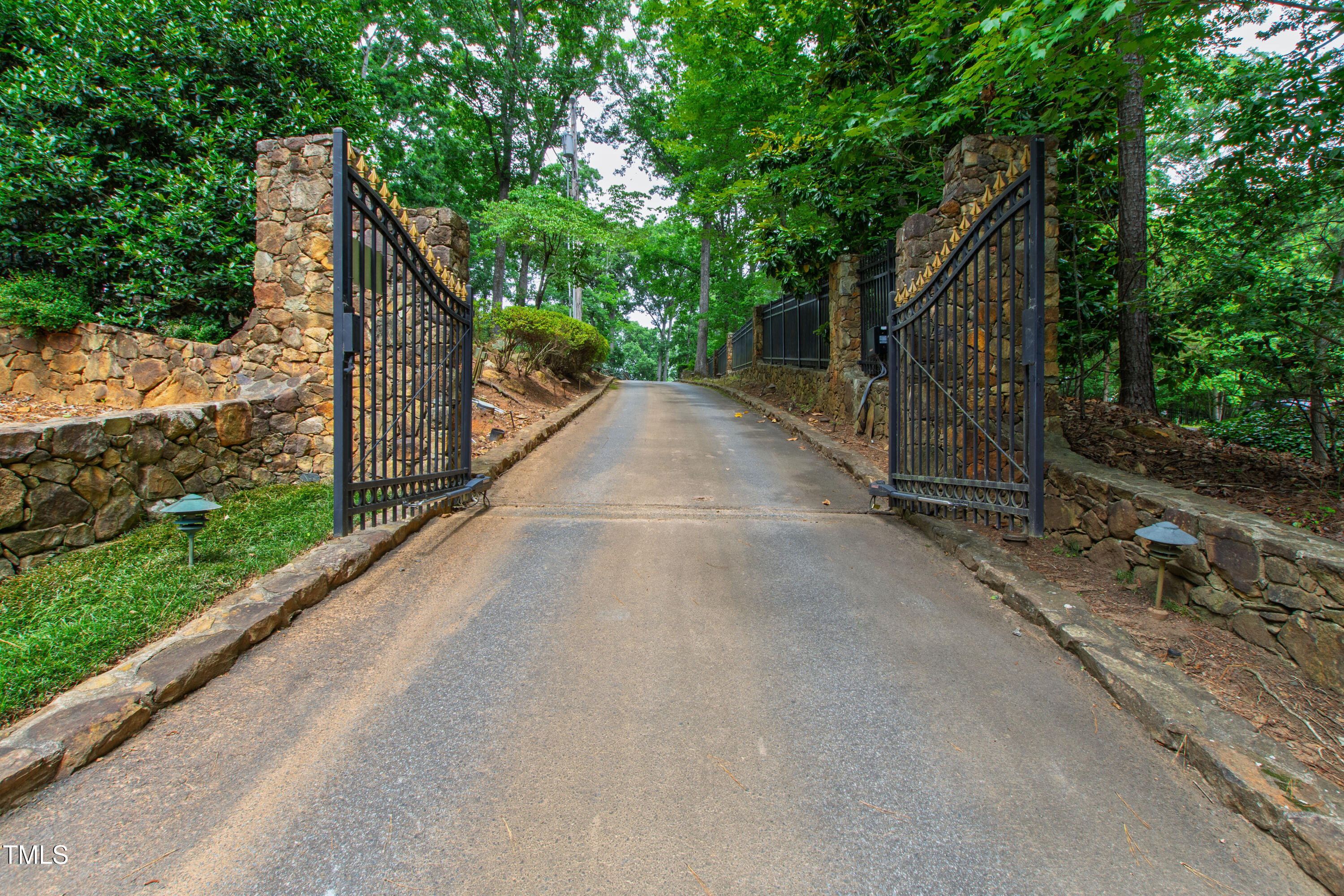 812 Kenmore Road Chapel Hill, NC 27514 - Photo 2 of 95 a view of a wooden bridge with a yard