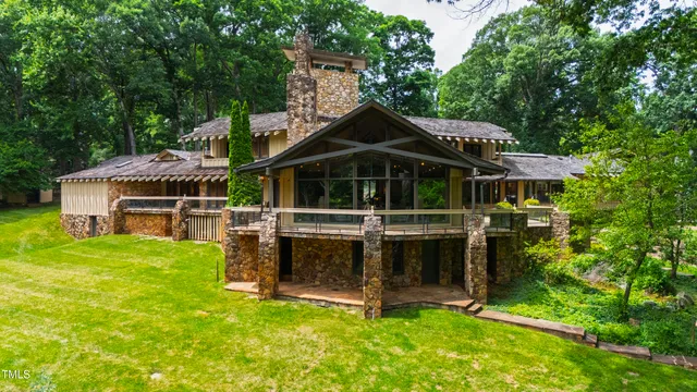 a bed room with a bed and a chandelier