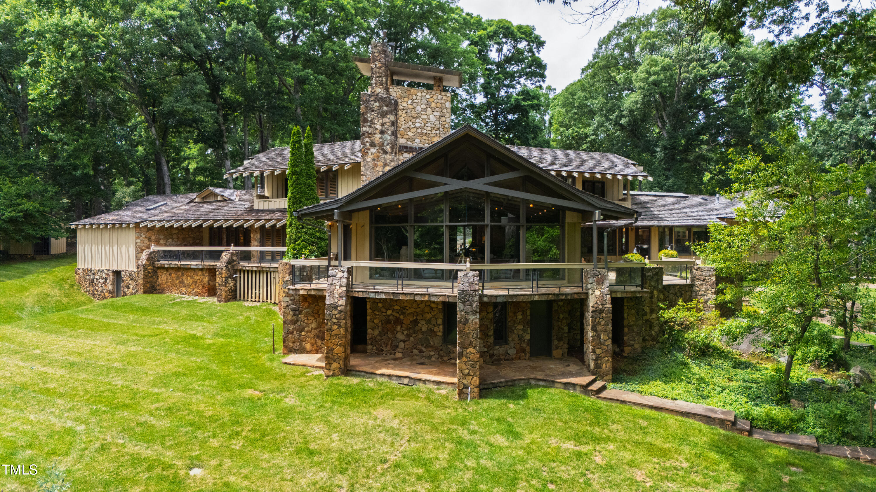 812 Kenmore Road Chapel Hill, NC 27514 - Photo 23 of 95 a view of house with a garden and swimming pool
