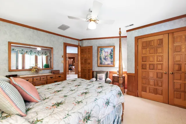 a view of a room with wooden floor and windows