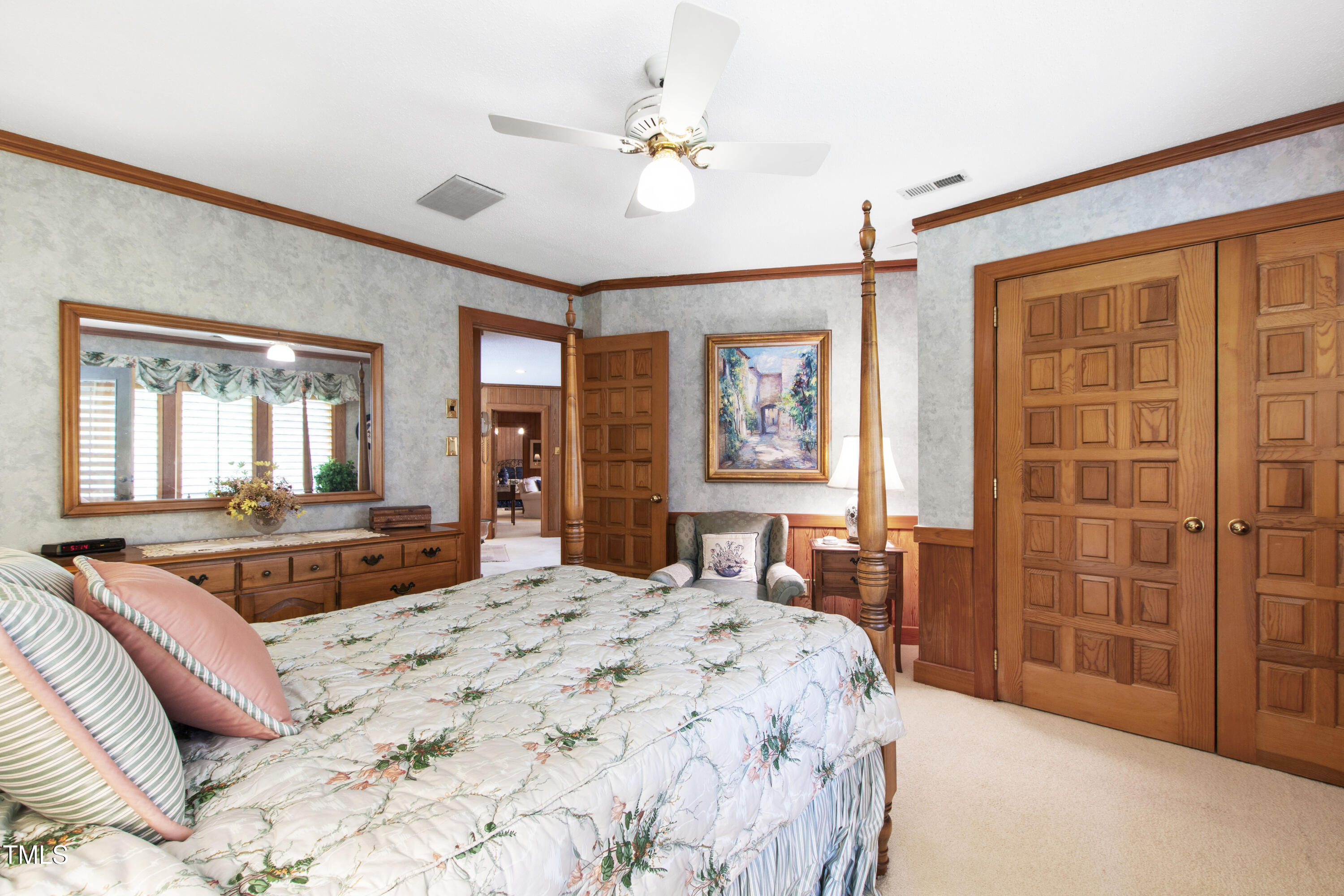 812 Kenmore Road Chapel Hill, NC 27514 - Photo 33 of 95 a bedroom with a bed and dresser with mirror