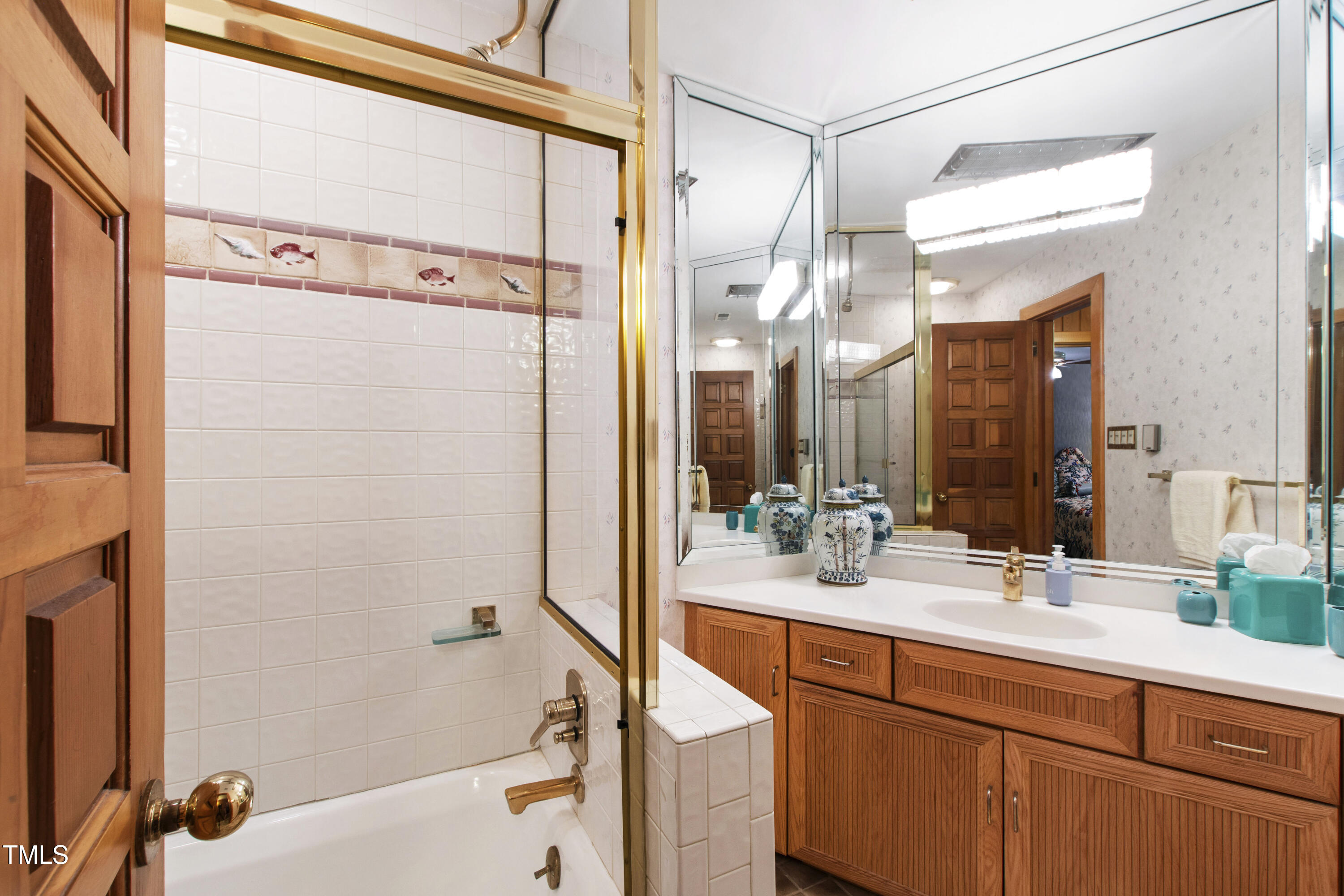 812 Kenmore Road Chapel Hill, NC 27514 - Photo 34 of 95 a bathroom with a double vanity sink mirror and shower