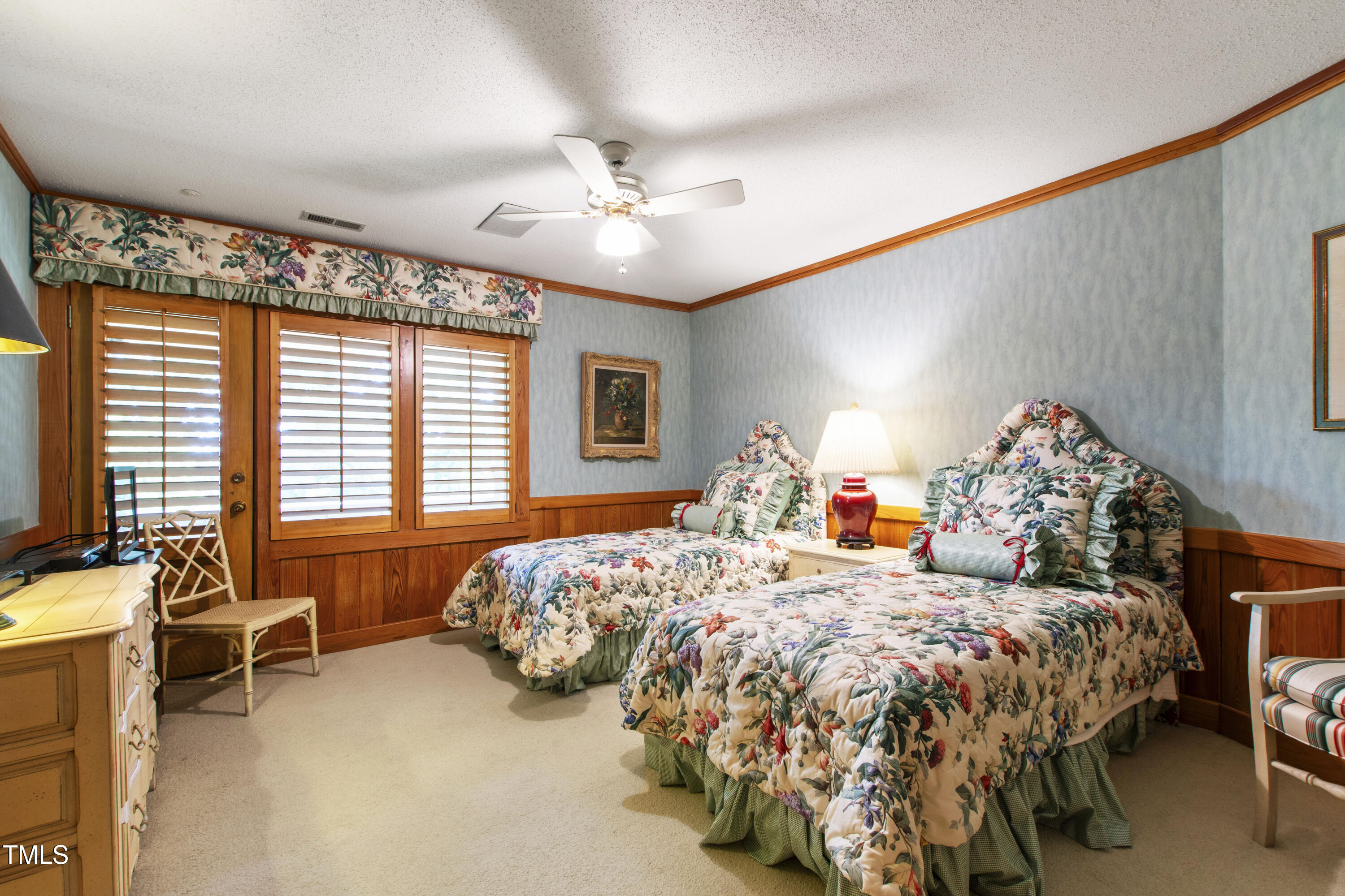 812 Kenmore Road Chapel Hill, NC 27514 - Photo 35 of 95 a bedroom with a bed and a chandelier