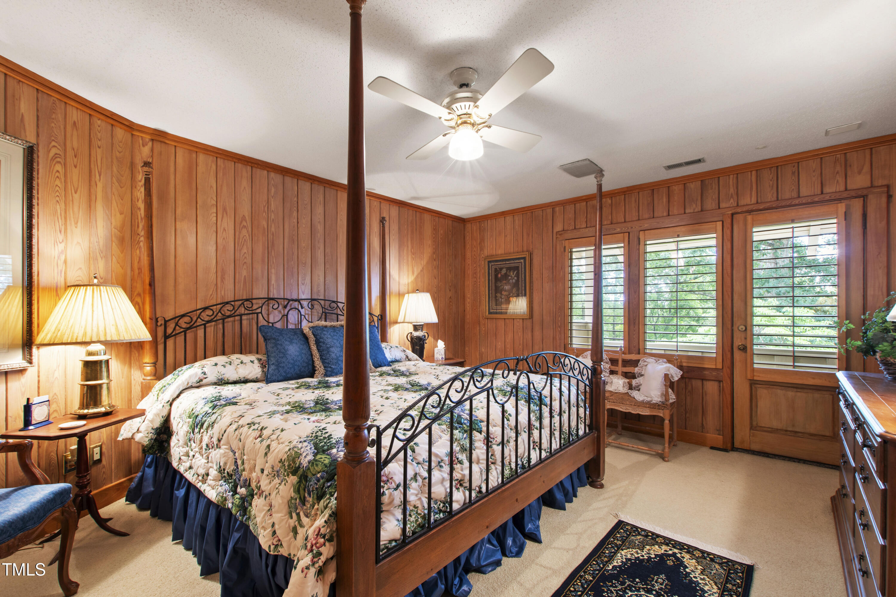 812 Kenmore Road Chapel Hill, NC 27514 - Photo 40 of 95 a bed room with a bed and a chandelier