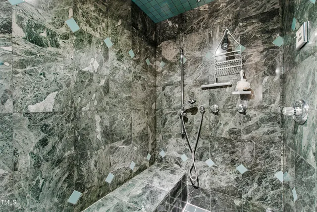 a living room with furniture a fireplace and a table