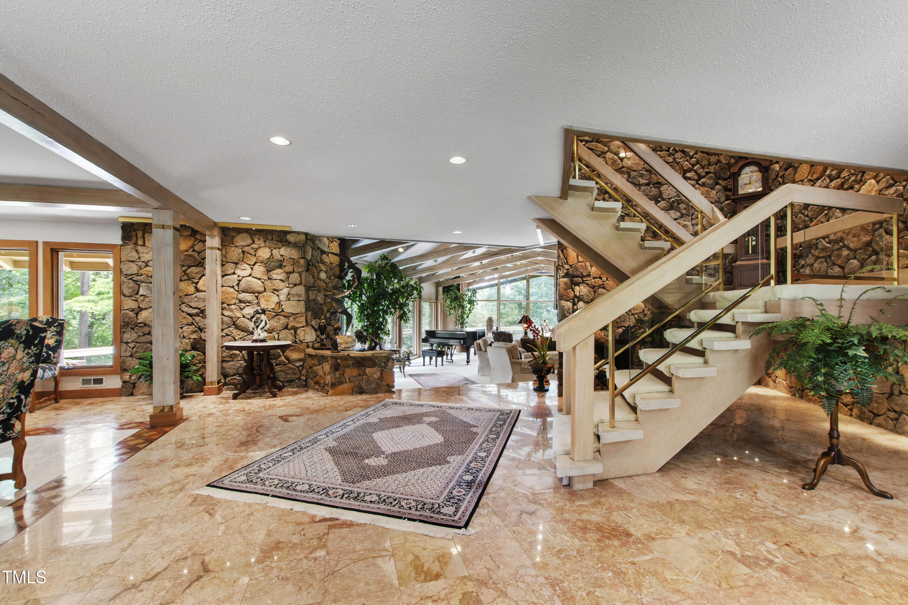 812 Kenmore Road Chapel Hill, NC 27514 - Photo 50 of 95 a very nice looking room with a large window and potted plants