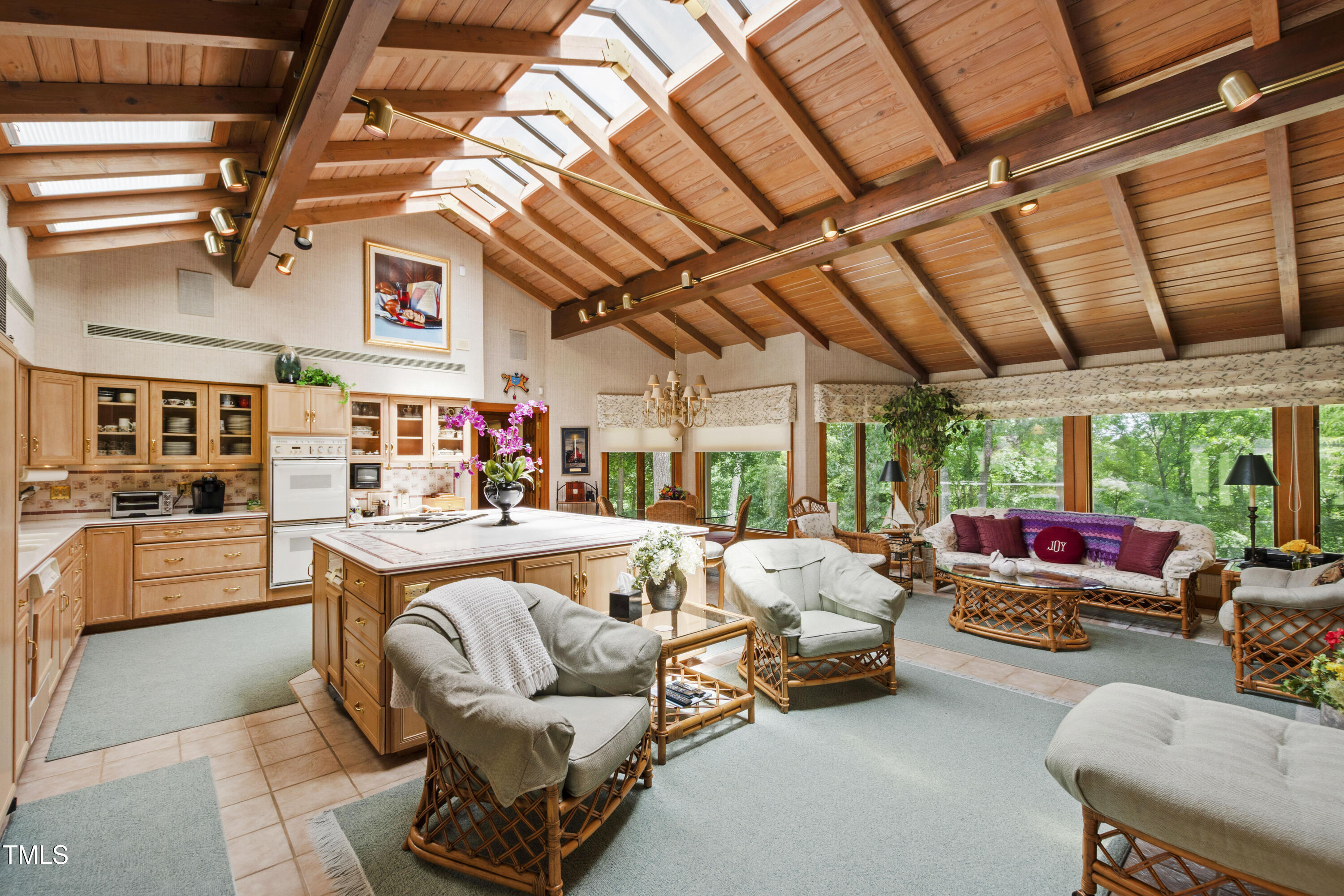 812 Kenmore Road Chapel Hill, NC 27514 - Photo 58 of 95 a living room with furniture ceiling fan and a rug
