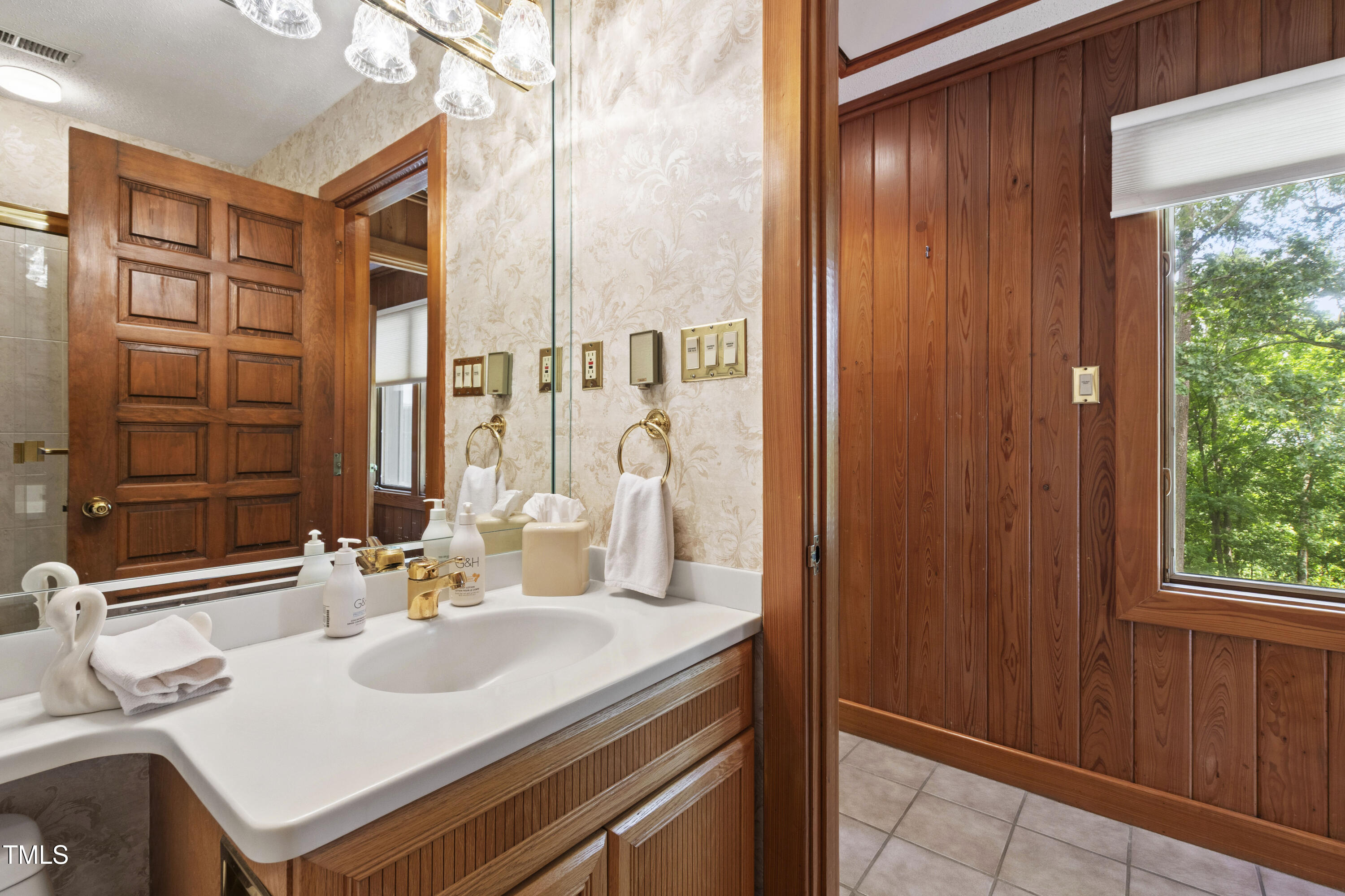 812 Kenmore Road Chapel Hill, NC 27514 - Photo 67 of 95 a bathroom with a sink and a mirror