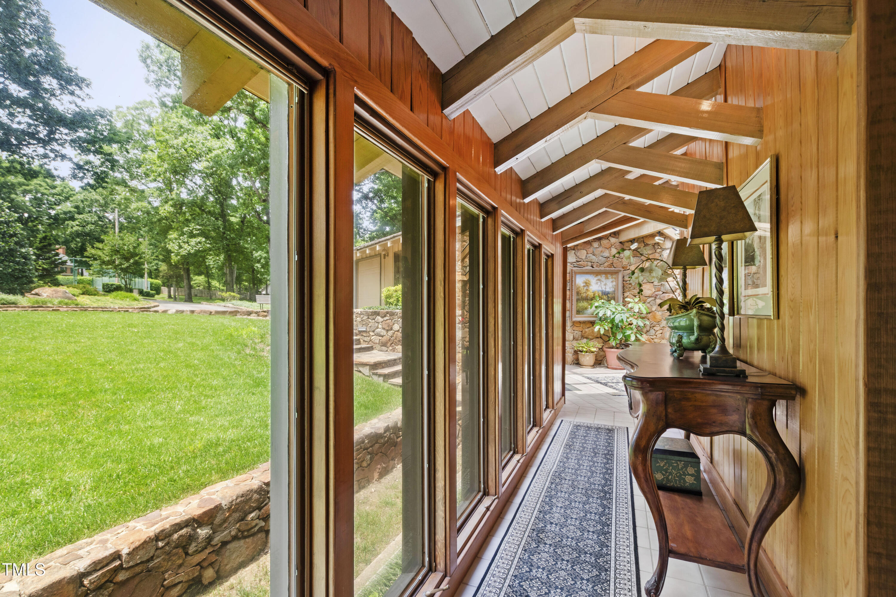812 Kenmore Road Chapel Hill, NC 27514 - Photo 69 of 95 a view of a porch with furniture and a yard