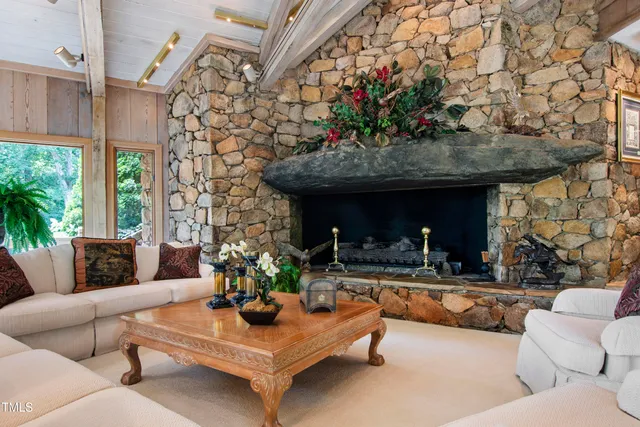 a bedroom with two beds and a large window