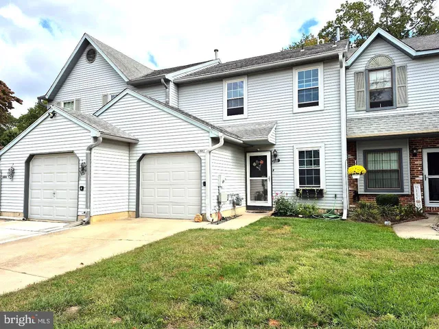 a house that has a big yard in front of it