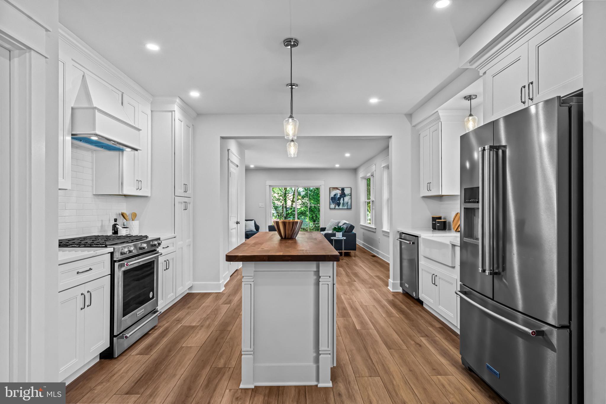 406 St Davids Avenue Wayne, PA 19087 - Photo 12 of 53 a kitchen with stainless steel appliances a refrigerator sink and stove