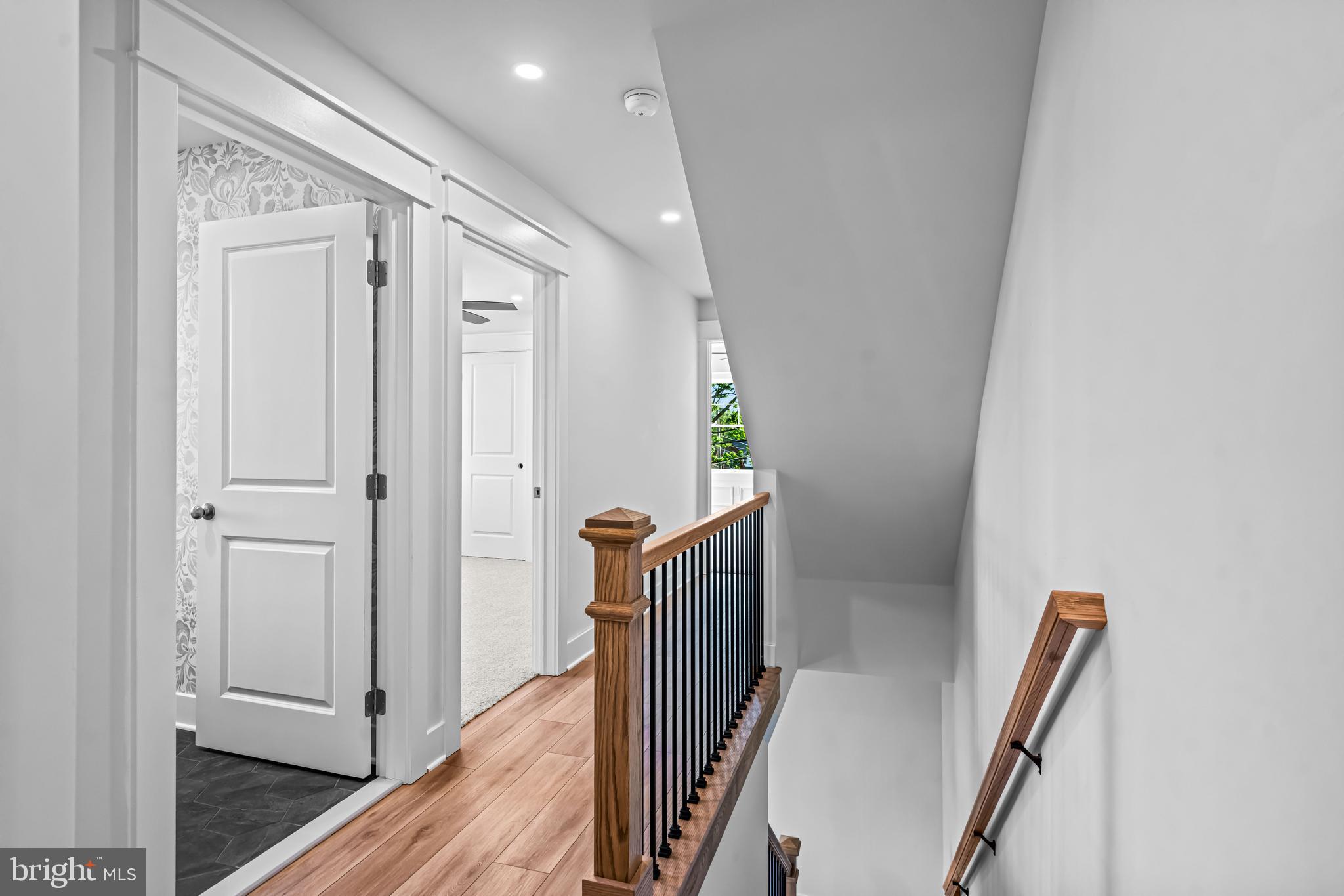 406 St Davids Avenue Wayne, PA 19087 - Photo 32 of 53 a view of a hallway with wooden floor and stairs