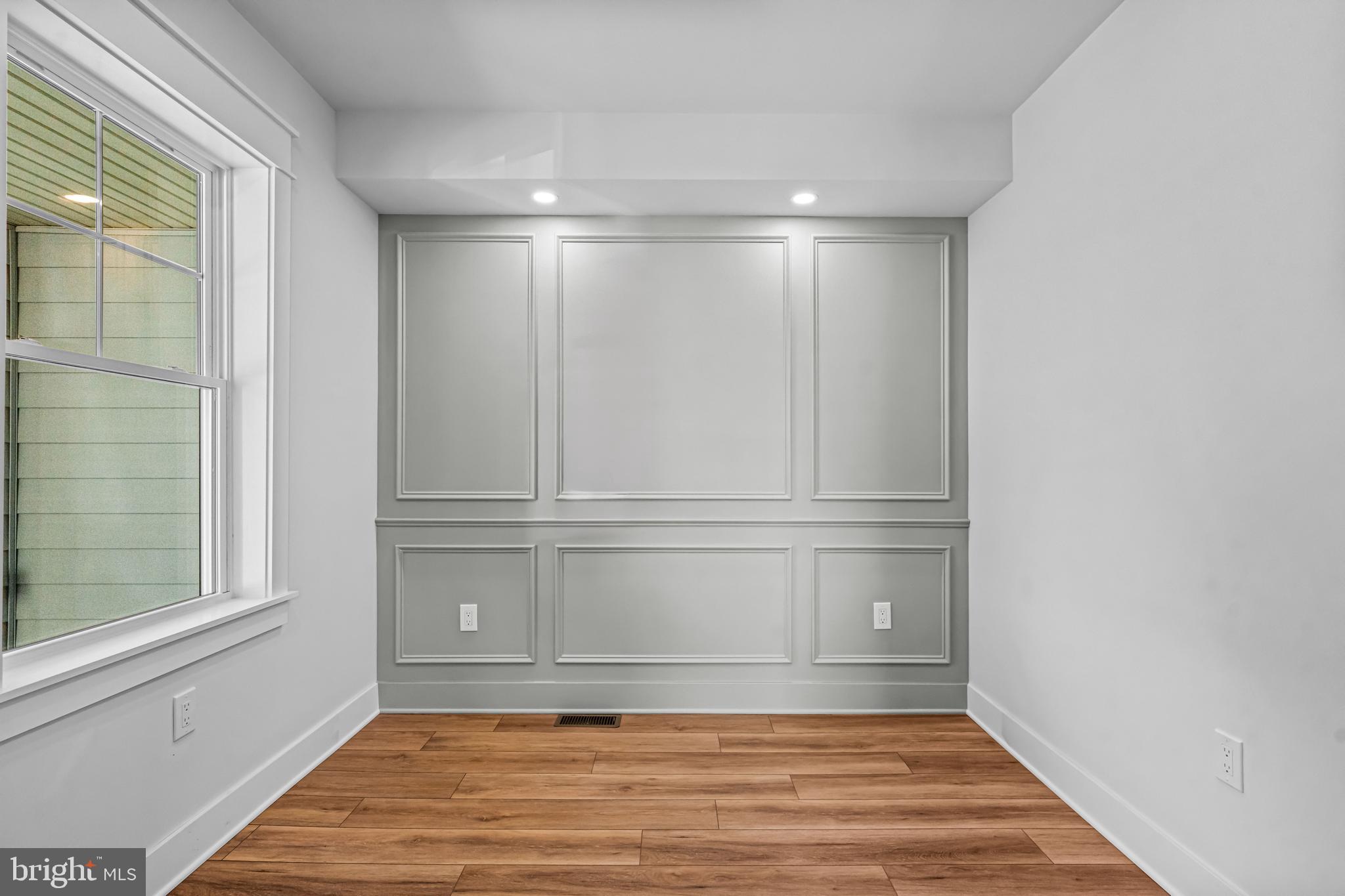 406 St Davids Avenue Wayne, PA 19087 - Photo 6 of 53 a view of an empty room with wooden floor and a window