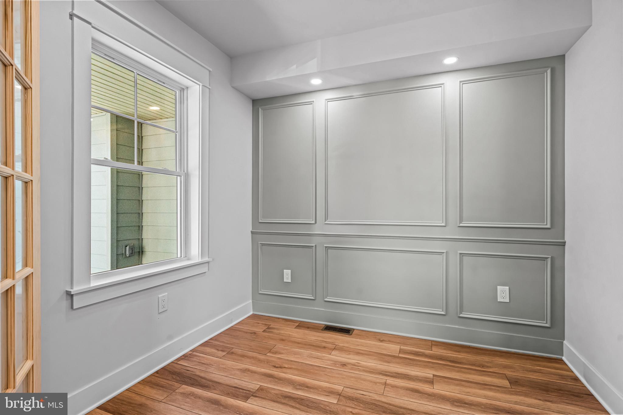 406 St Davids Avenue Wayne, PA 19087 - Photo 7 of 53 a view of empty room with wooden floor and fan