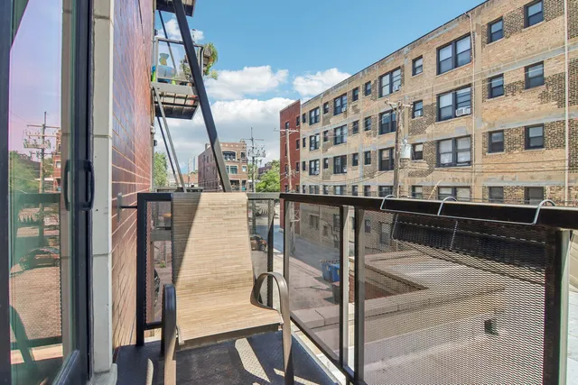 a bathroom with a tub a sink and mirror