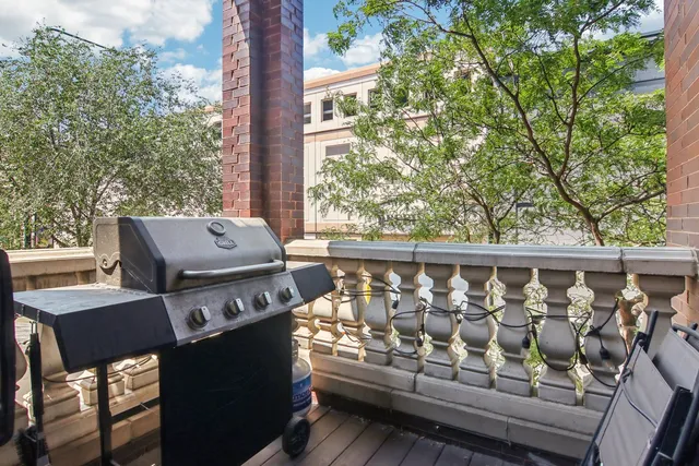a view of a balcony with furniture