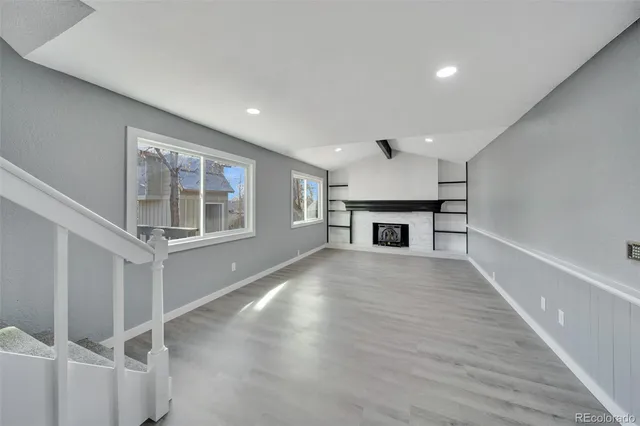 a view of room with furniture and a fireplace