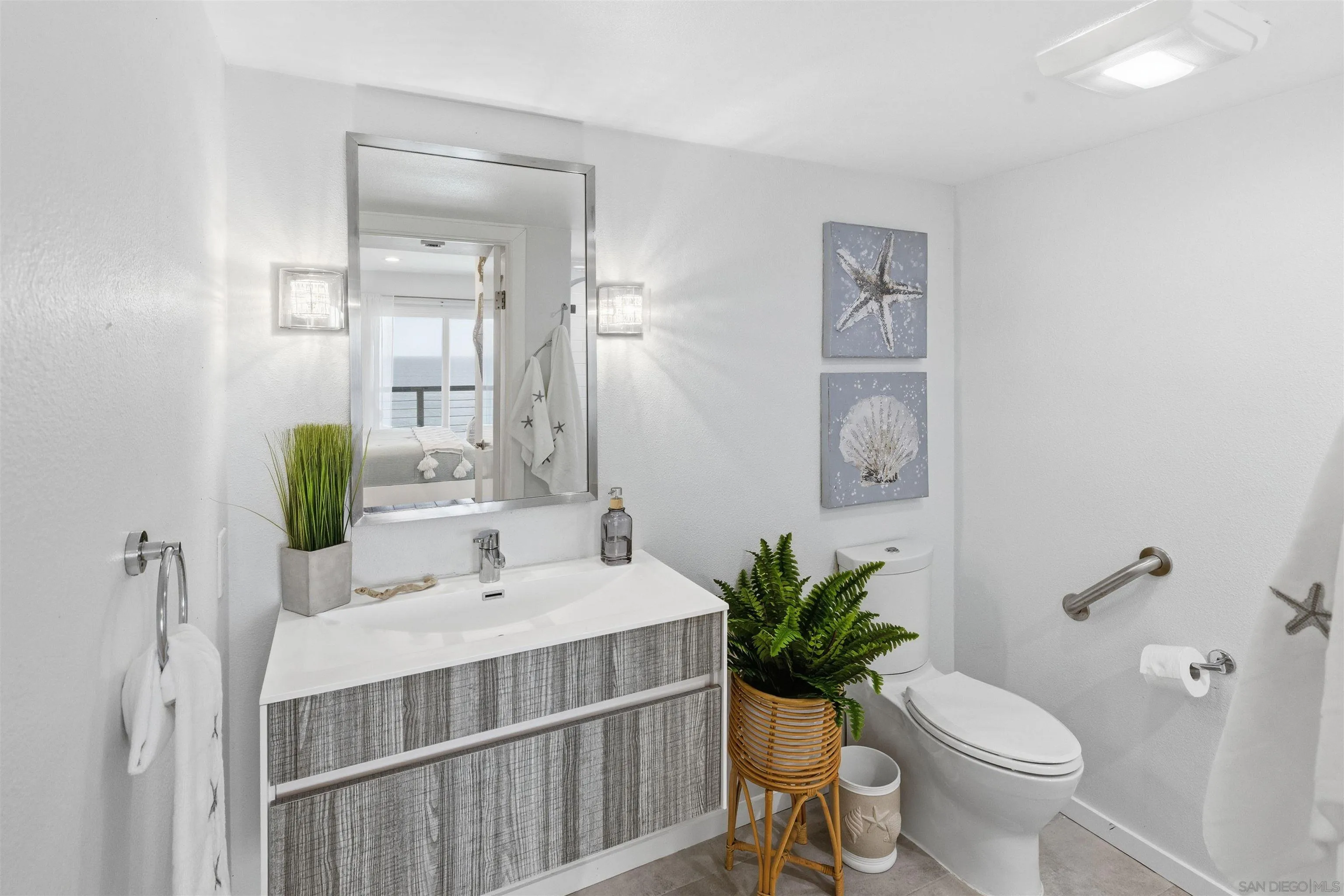 940 Sealane Drive, Unit 5 Encinitas, CA 92024 - Photo 13 of 48 a bathroom with a sink toilet and shower